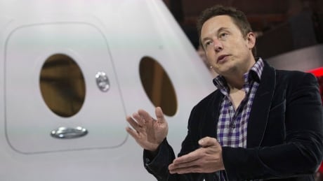 SpaceX CEO Elon Musk speaks after unveiling the Dragon V2 spacecraft in Hawthorne, California May 29, 2014. Space Exploration Technologies announced April 27, 2016, it will send uncrewed Dragon spacecraft to Mars as early as 2018, a first step in company founder Elon Musk's goal to fly people to another planet. SPACEX CEO Elon Musk Dragon V2 unveiling 2014
