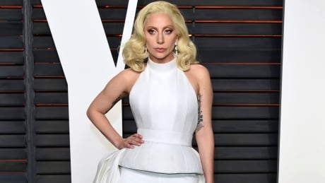 FILE - In this Feb. 28, 2016 file photo, Lady Gaga arrives at the Vanity Fair Oscar Party in Beverly Hills, Calif. Lady Gaga is choosing the intimacy of dive bars over arenas to showcase songs from her new album, "Joanne." She'll appear at a handful of bars beginning this week as a nod to the album's "raw Americana" vibe and where she got her start, Gaga and tour partner Bud Light announced Sunday, Oct. 2, 2016. Lady Gaga Dive Tour