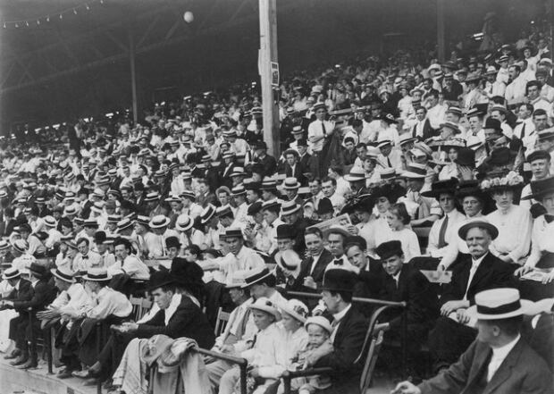 Spectators watching ball game at Hanlan's Point ballpark