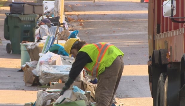 Garbage cleanup after flood CBRM