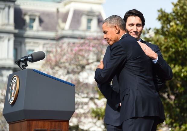 Obama Trudeau hug