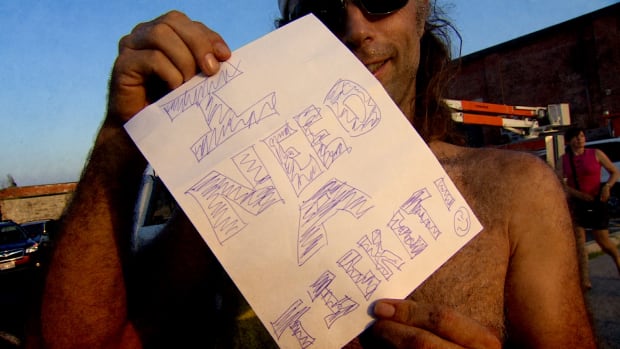 Sign saying "Fans Need Tickets"