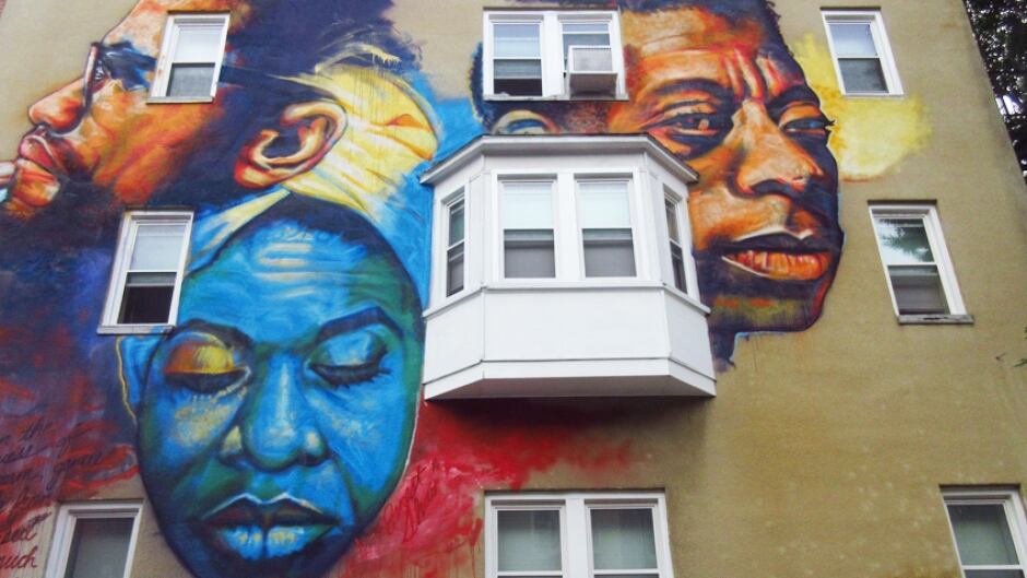 Artist Ernest Shaw's portrait of three civil rights icons: Nina Simone, James Baldwin and Malcolm X in east Baltimore