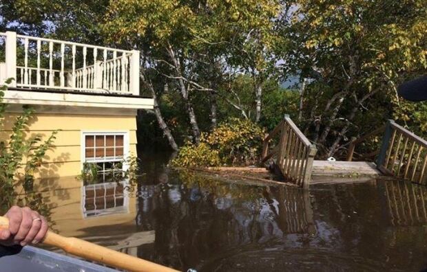 Terry Drohan boating into his house