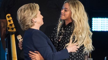 Beyonce, right, and Democratic presidential candidate Hillary Clinton embrace during a campaign rally in Cleveland, Friday, Nov. 4, 2016. APTOPIX Campaign 2016 Clinton