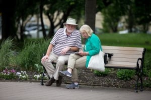 Elderly couple park bench