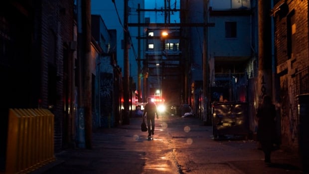alley man and ambulance