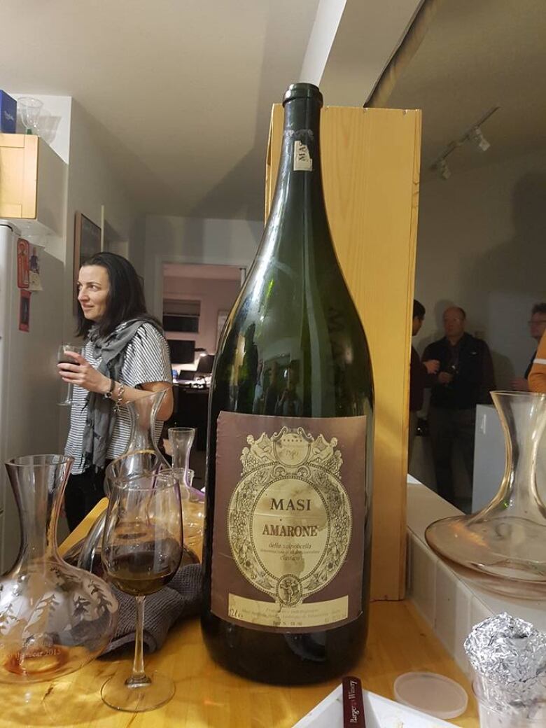 Ahead of surgery, man finally opens giant bottle of wine from 1995