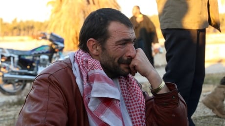 A Syrian man who was evacuated from of Aleppo cries upon his arrival in the opposition-controlled Khan al-Aassal region on Dec. 15, 2016. AFP_J636F