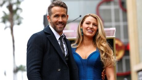 Actor Ryan Reynolds poses with his wife Blake Lively after unveiling his star on the Hollywood Walk of Fame in Hollywood, California U.S., December 15, 2016. REUTERS/Mario Anzuoni - RTX2V9CK PEOPLE-RYANREYNOLDS/STAR