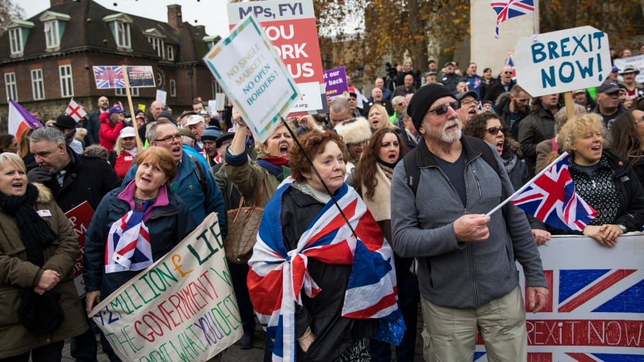 Pro-Brexit demonstrators protest outside the Houses of Parliament on November 23, 2016 in London, England. British Prime Minister Theresa May has said that she will not delay triggering article 50, the formal process of leaving the European Union, but wants to avoid a "cliff edge".