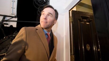 Minister of Finance Bill Morneau looks back in response to a reporter's question as he arrives at 7 Rideau Gate for a working dinner with provincial and territorial finance ministers, on Sunday, Dec. 18, 2016. Finance Ministers 20161218