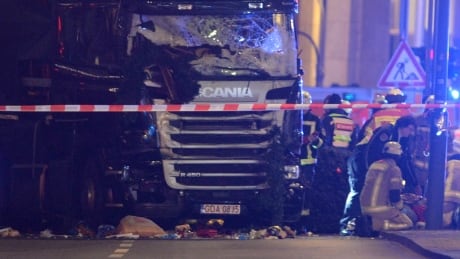 Rescue workers inspect the scenes and the truck that crashed into a Christmas market, close to the Kaiser Wilhelm memorial church in Berlin, Germany, 19 December 2016. According to the police, several people are reported killed and many injured in what police suspect it was a deliberate attack. epaselect GERMANY BERLIN LORRY CRASHED INTO CHRISTMAS MARKET