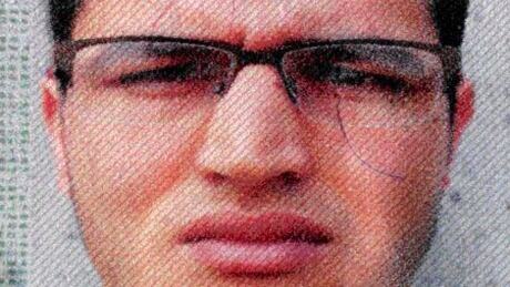 The photo issued by German federal police on Wednesday shows 24-year-old Tunisian Anis Amri on a photo that was used on the documents found in the truck. He is suspected of being involved in the fatal attack on Dec. 19. Germany Christmas Market