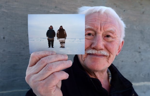Piita Irniq holds photograph of Marius Tungilik
