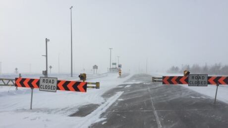 Much of the Trans-Canada highway was closed Monday after a major winter storm in the province. Roads
