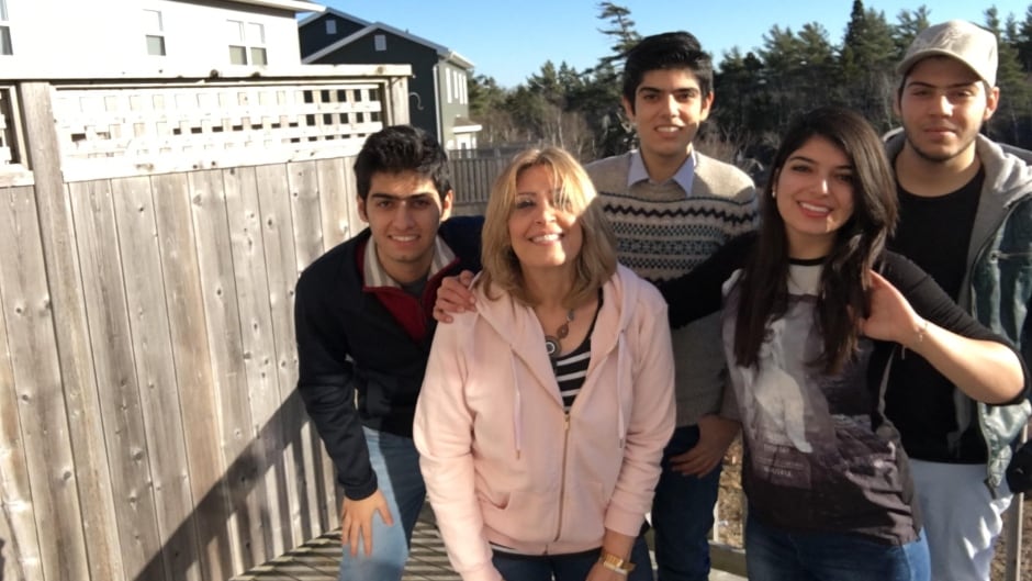 Syrian refugees Lina Arafeh and her kids live in Halifax but plans to move to a bigger city hoping to find work.