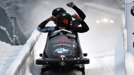 Canada's Kaillie Humphries and Melissa Lothholz celebrate after winning the women's bobsleigh World Cup competition in Altenberg, Germany on Friday. Germany Bob World Cup