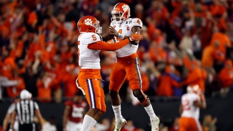 Clemson's Deshaun Watson and Shaq Smith (5) celebrate a last-second touchdown during the second half of the NCAA college football playoff championship game against Alabama. clemson-alabama