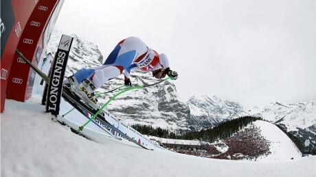 Switzerland's Patrick Kueng takes the start on his way to win an alpine ski, men's World Cup downhill, in Wengen, Switzerland, Saturday, Jan. 18, 2014. Patrick Kueng gave his home Swiss fans a lot to cheer about by winning the shortened Lauberhorn downhill Saturday. Kueng clocked 1 minute, 32.66 seconds down a course that had more than a minute of racing and signature features cut off due to strong winds, to earn his second World Cup victory, and first in downhill. (AP Photo/Shinichiro Tanaka) wengen-lauberhorn-1180