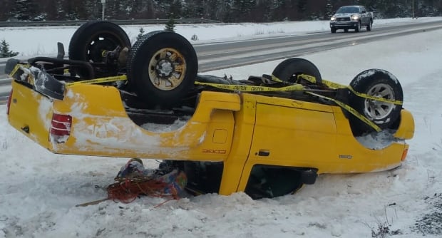 Yellow pickup truck flipped THC holyrood