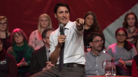 Prime Minister Justin Trudeau points to a member of the audience during a town hall meeting in Belleville, Ont. on Thursday, January 12, 2017. Trudeau Tour 20170112