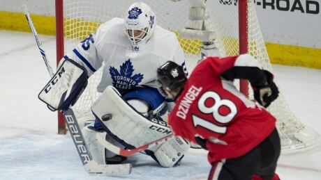 Curtis McElhinney, left, shut the door on the Senators for the majority of the night. HKN Maple Leafs Senators 20170114