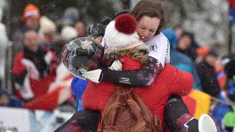 Canadian skeleton athlete Elisabeth Vathje celebrates her first place run with her mother at the women's skeleton World Cup event in Winterberg, Germany, on Sunday. Germany Skeleton World Cup