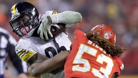 Pittsburgh's Le'Veon Bell is tackled by Kansas City's Ramik Wilson during the Steelers 18-16 win over the Chiefs in the AFC Divisional Playoff, on Monday, in Kansas City. Steelers-Chiefs-15012017