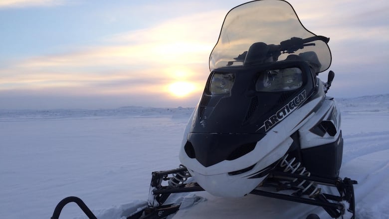 A snowmobile on the snowy tundra