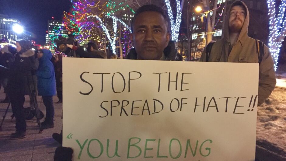 A sign at a vigil in Edmonton, in January, after the Quebec mosque shooting.