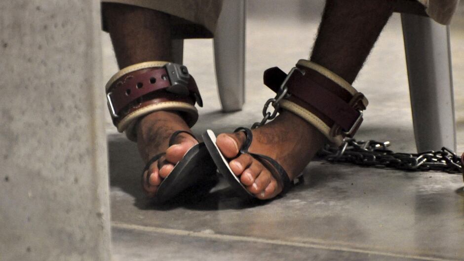 In this photo, reviewed by a U.S. Department of Defense official, a Guantanamo detainee's feet are shackled to the floor as he attends a "Life Skills" class inside the Camp 6 high-security detention facility at Guantanamo Bay U.S. Naval Base in this file pool photo taken April 27, 2010. Nearly two-thirds of Americans believe torture can be justified to extract information from suspected terrorists, according to a Reuters/Ipsos poll, a level of support similar to that seen in countries like Nigeria where militant attacks are common.