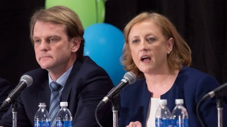 Lisa Raitt speaks as Chris Alexander, left, looks on during the Conservative leadership candidates' debate, in Halifax on Saturday, Feb. 4, 2017. Conservatives vote for a new party leader on May 27, 2017. Conservative Leadership Debate 20170204
