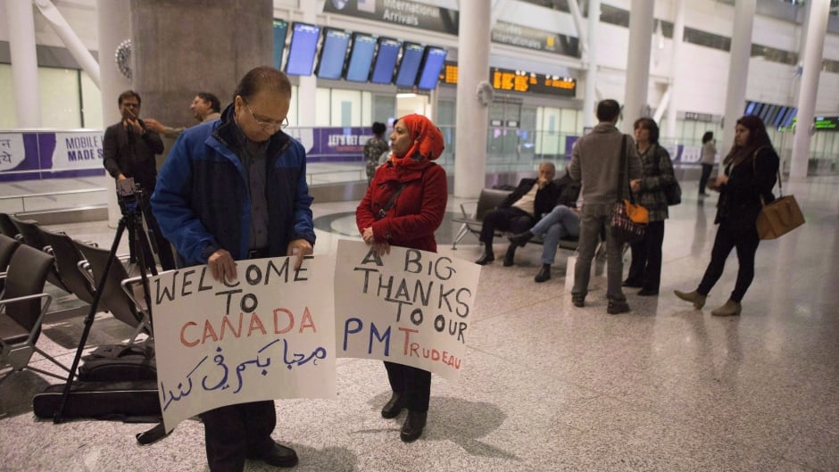 Well-wishers gather in the hope of greeting Syrian refugees arriving on the first government arranged flight at Toronto's Pearson Airport, on Dec. 10, 2015.