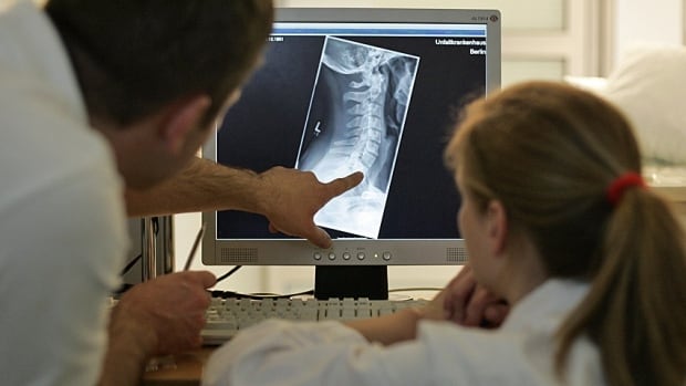 Doctors look at x-ray