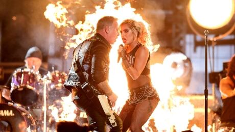 Lady Gaga, right, and James Hetfield of Metallica share a mic during a performance of Moth Into Flame at the 59th annual Grammy Awards on Feb. 12. Hetfield encountered microphone issues at the beginning of the performance. Grammys-Hetfield-Gaga