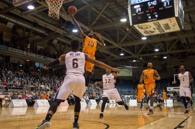 Island Storm player #13 Terry Thomas goes for the basket