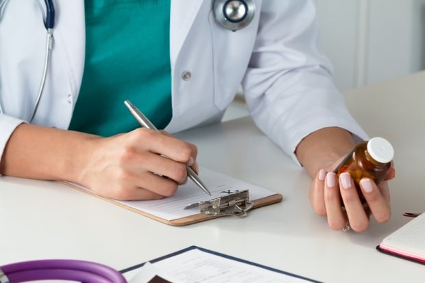 Doctor writing prescription