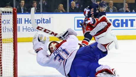 NEW YORK, NY - FEBRUARY 21: Carey Price #31 of the Montreal Canadiens makes the diving save in the closing seconds of overtime against J.T. Miller #10 of the New York Rangers at Madison Square Garden on February 21, 2017 in New York City. The Canadiens defeated the Rangers 3-2 in the shootout. (Photo by Bruce Bennett/Getty Images) 94610952