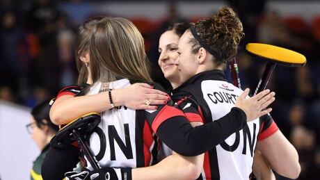 Ontario's team Homan hug after defeating Northern Ontario in the semifinals of the Scotties Tournament of Hearts in St. Catharines, Ont., on Saturday, Feb. 25, 2017. homan-rachel