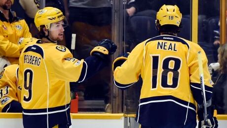 Nashville Predators right wing James Neal congratulates left wing Filip Forsberg after Forsberg scored a goal against the Edmonton Oilers in Sunday's 5-4 win. forsberg-neal