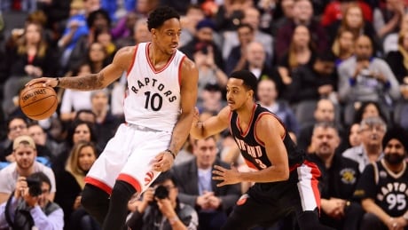 Toronto Raptors guard DeMar DeRozan (10) protects the ball from Portland Trail Blazers guard C.J. McCollum (3) during first half. raptors-trailblazers