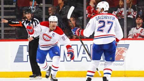 Montreal Canadiens' Max Pacioretty, left, celebrates Alex Galchenyuk's overtime winner Tuesday against New Jersey. galchenyuk-alex