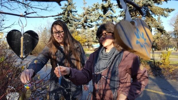 Sara Komarnisky (right) shown Nov. 2016 is disappointed the city has removed the hearts