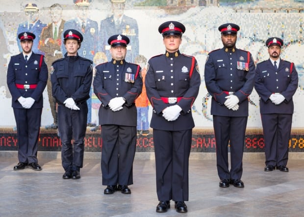 British photographer Rip Hopkins with members of the Ottwa Police Service