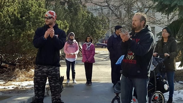 Family looks on as CCCC protests Motion 103 in Saskatoon