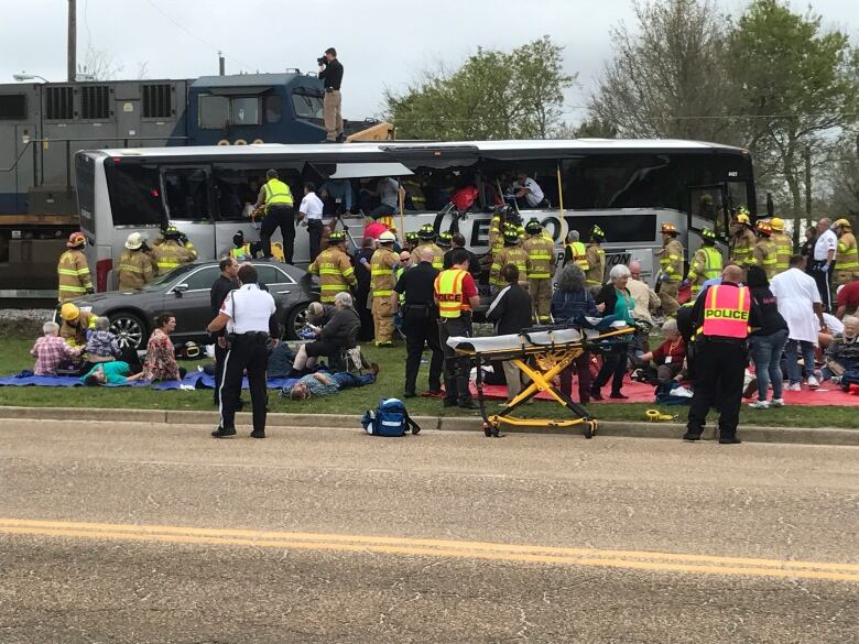 At least 4 killed, dozens injured when train hits bus in Mississippi