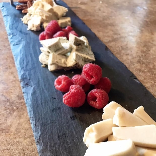 Fresh Start Fauxmage from P.E.I. on plate with nuts and berries