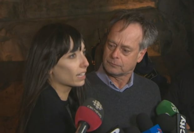 Jodie Emery and Marc Emery emerge from court