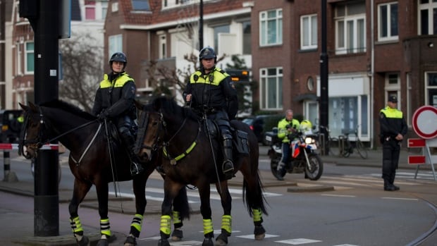 Mounted police block the road leading to the Turkish consul's residence in Rotterdam the Netherlands on Saturday